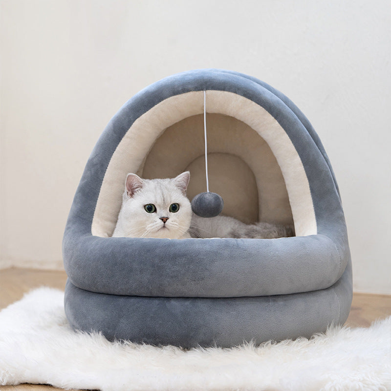 Crystal Velvet House Bed Gray crystal velvet semi-enclosed pet bed with plush cushion and hanging ball toy, with a white cat inside